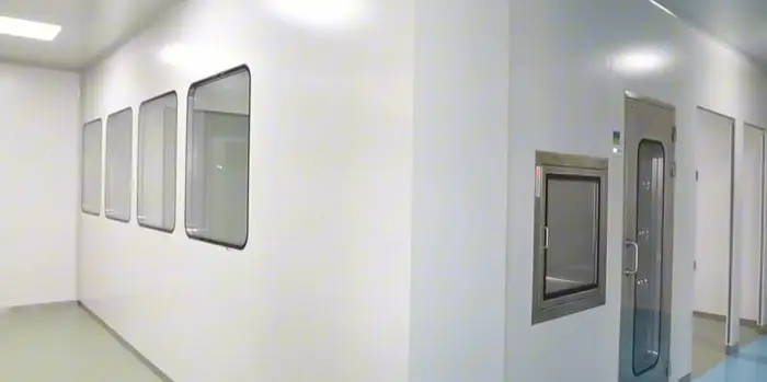 Modular cleanroom partition wall with integrated utilities